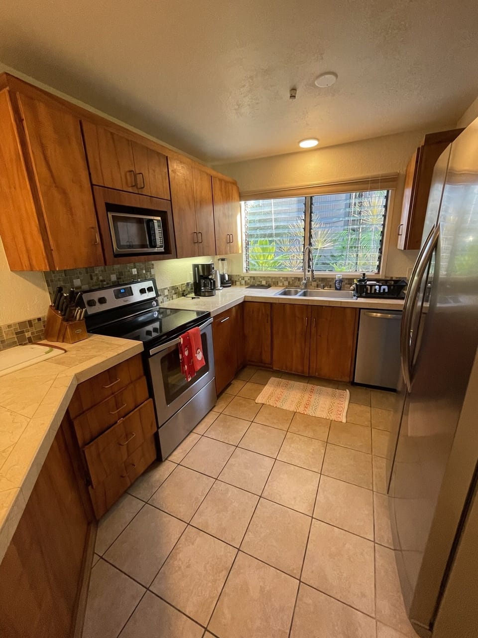 Kitchen with oven, stove, microwave, dishwasher, fridge/freezer, toast, coffee