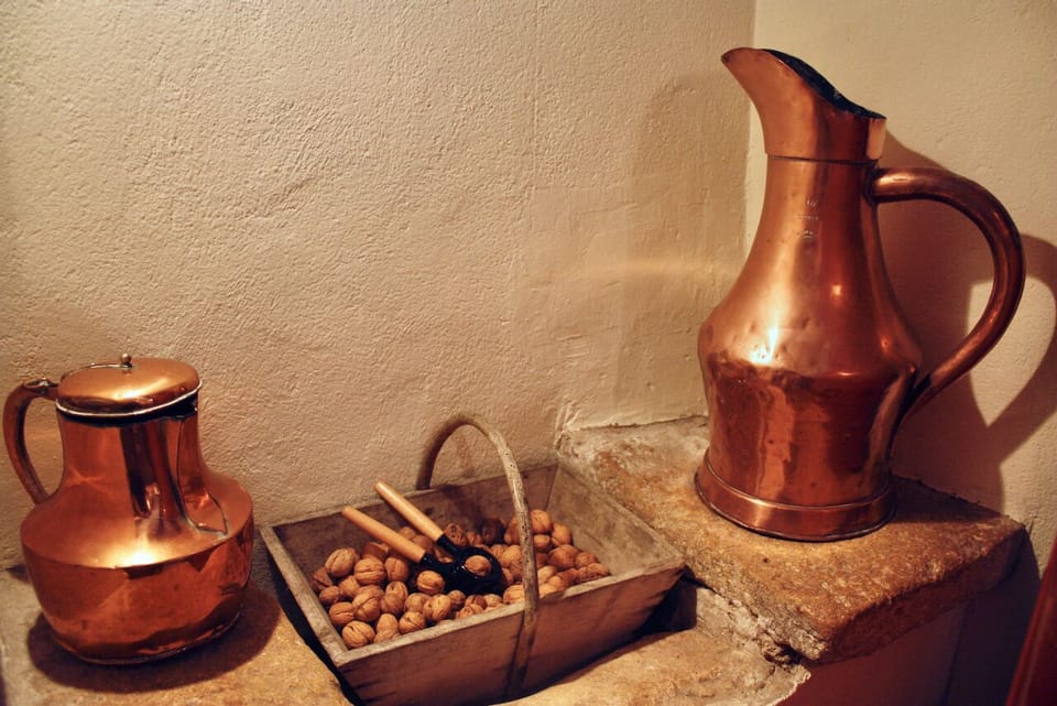 Original stone sink in the kitchen now holds the walnut basket