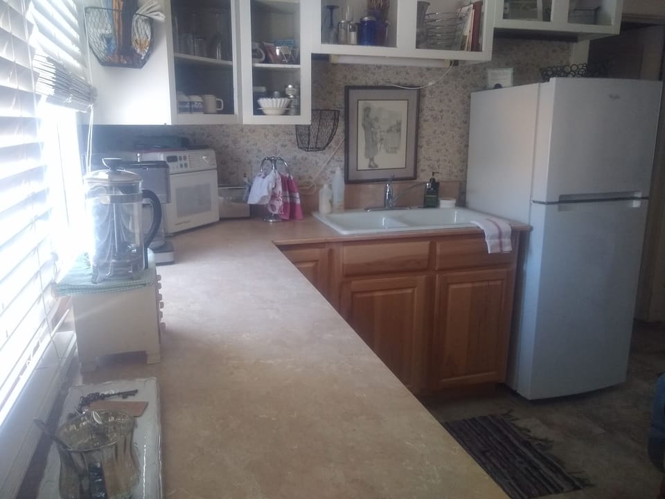 An efficient and well stocked kitchen awaits.  