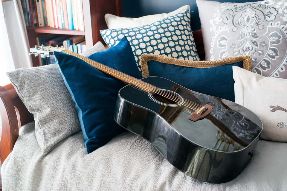 Guitar (w/tuner) is hanging on the wall in the library ready for you to play.