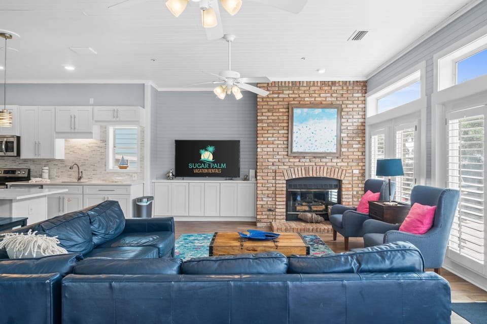 Plenty of comfortable seating and huge smart TV and fireplace.