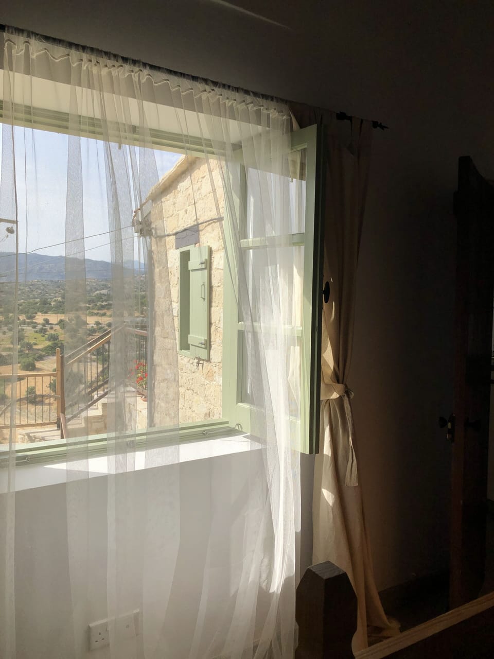 Bedroom window overlooking mountains