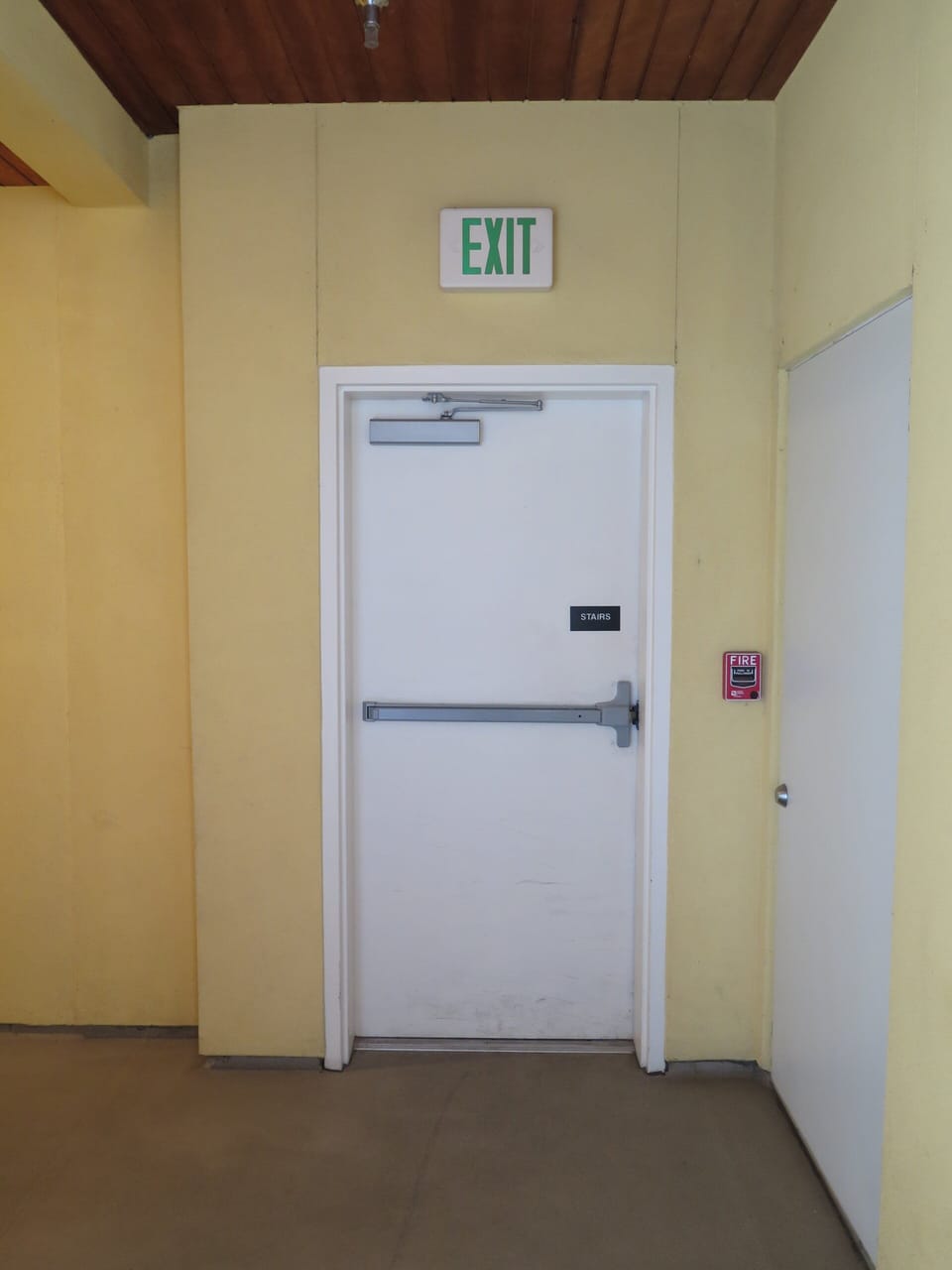Exit door outside from condo to alley.