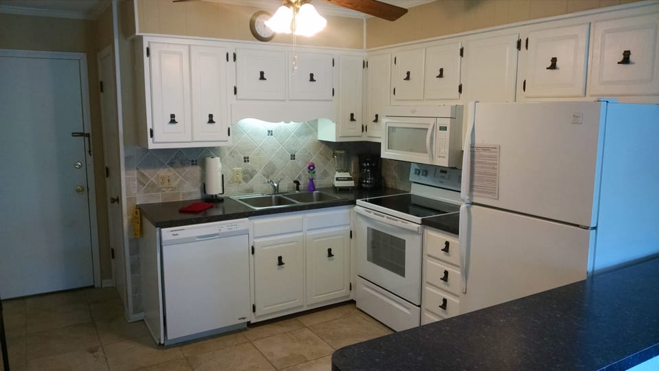 Stocked kitchen coffee maker & filters, blender, ice maker, toaster, $ cookware