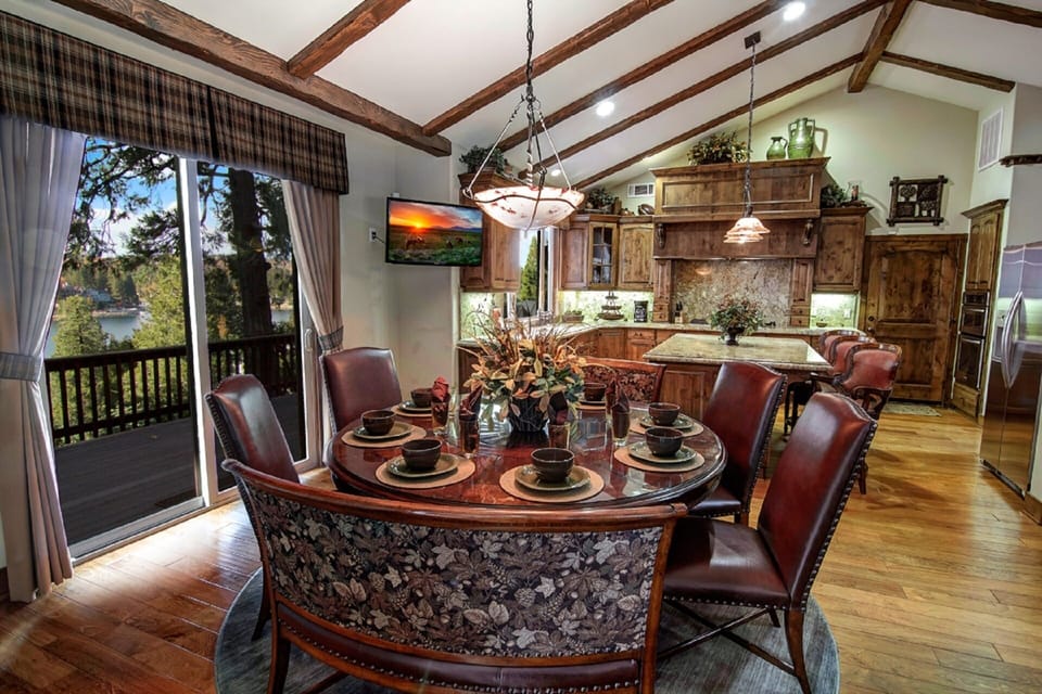 Circular dining table seats 8 adults, with a spectacular view of the lake.
