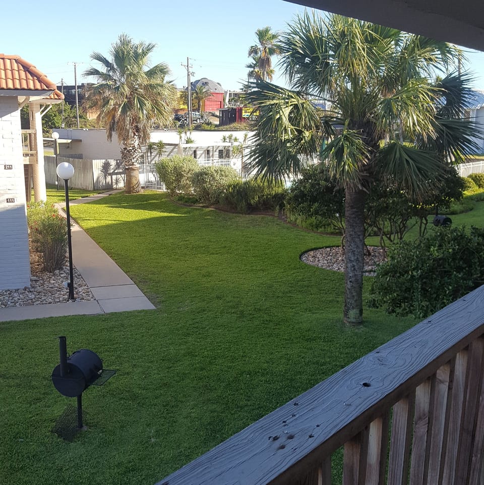 View of pool and ground from balcony