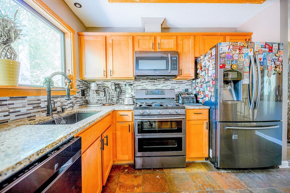 The BRAND NEW kitchen...totally gutted and remodeled...with all new appliances, cabinets...and even kitchen sink! 