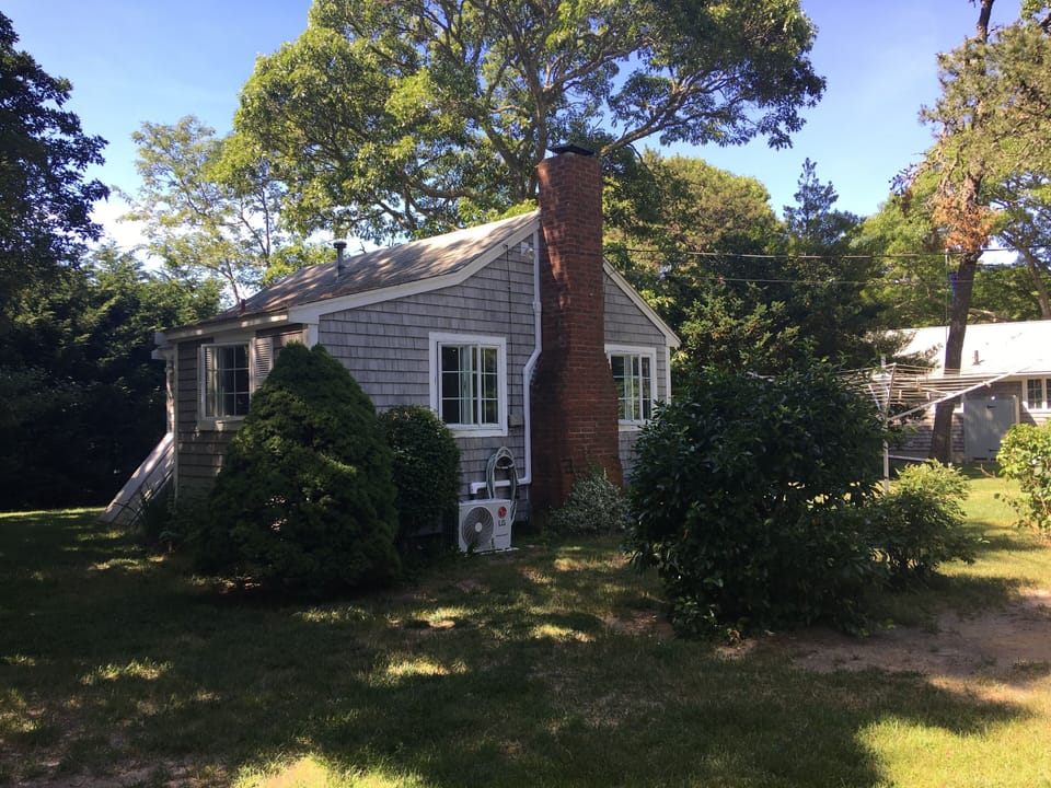 South side view of Cottage showing location of outside Ductless AC unit.