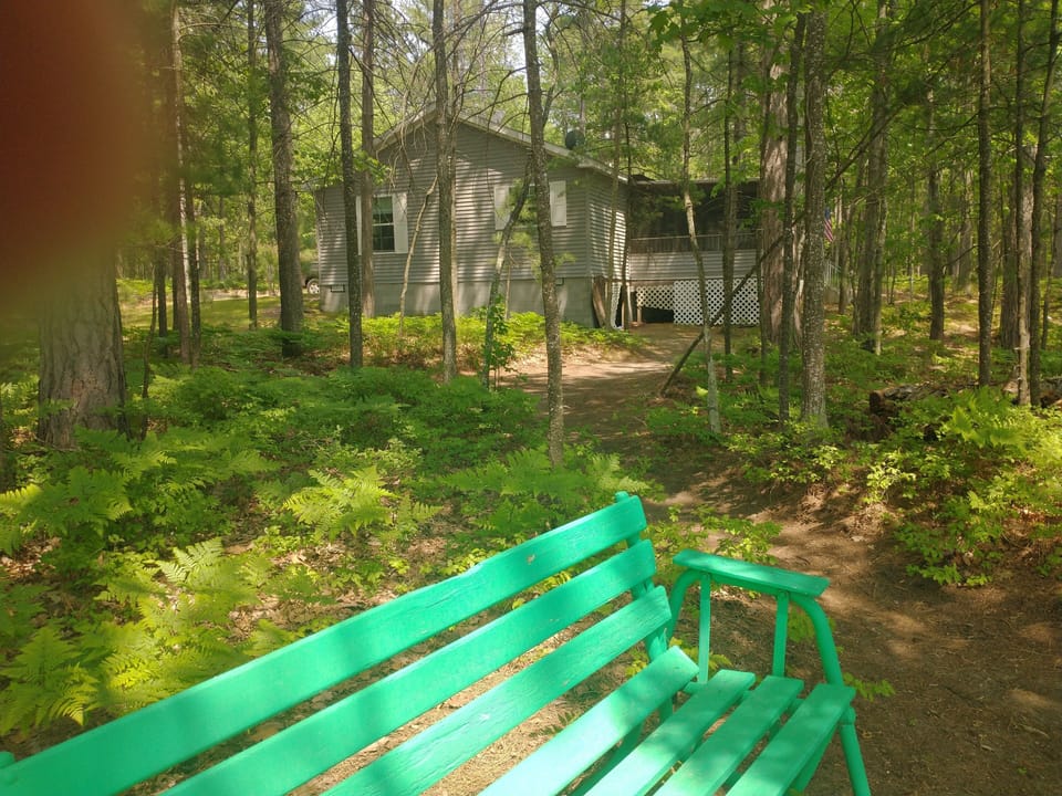 View of house from glider by lakeshore