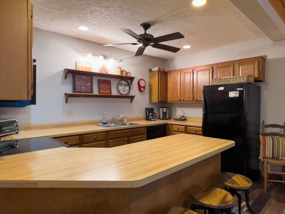 Open-concept kitchen with barstools