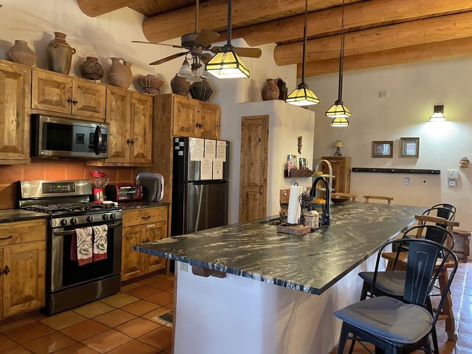 A chef's kitchen with LG black stainless steel appliances