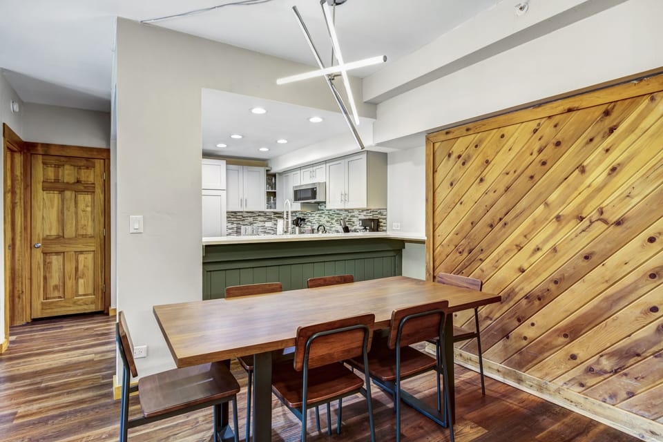 Large dining area with table that seats 6