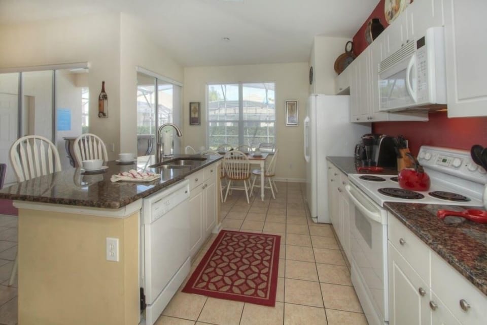 Kitchen with Island prep area and sink.