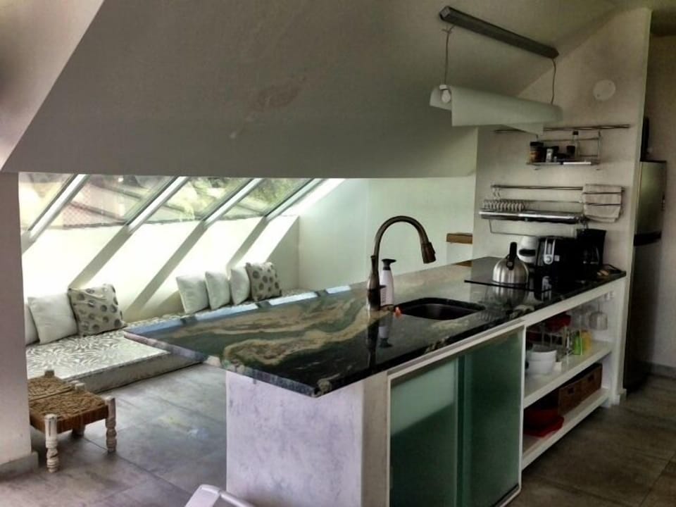 kitchen, see the mattresses behind where two more people can sleep