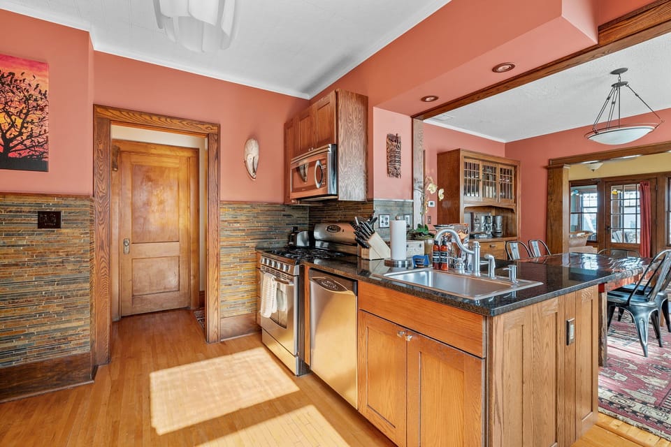 Your fully equipped kitchen features granite counters, oak cabinetry, and modern appliances perfect for preparing memorable meals together.
