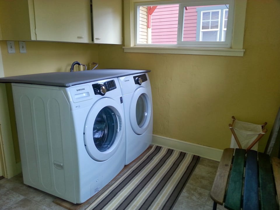 Energy and water conserving front loading washer and dryer.