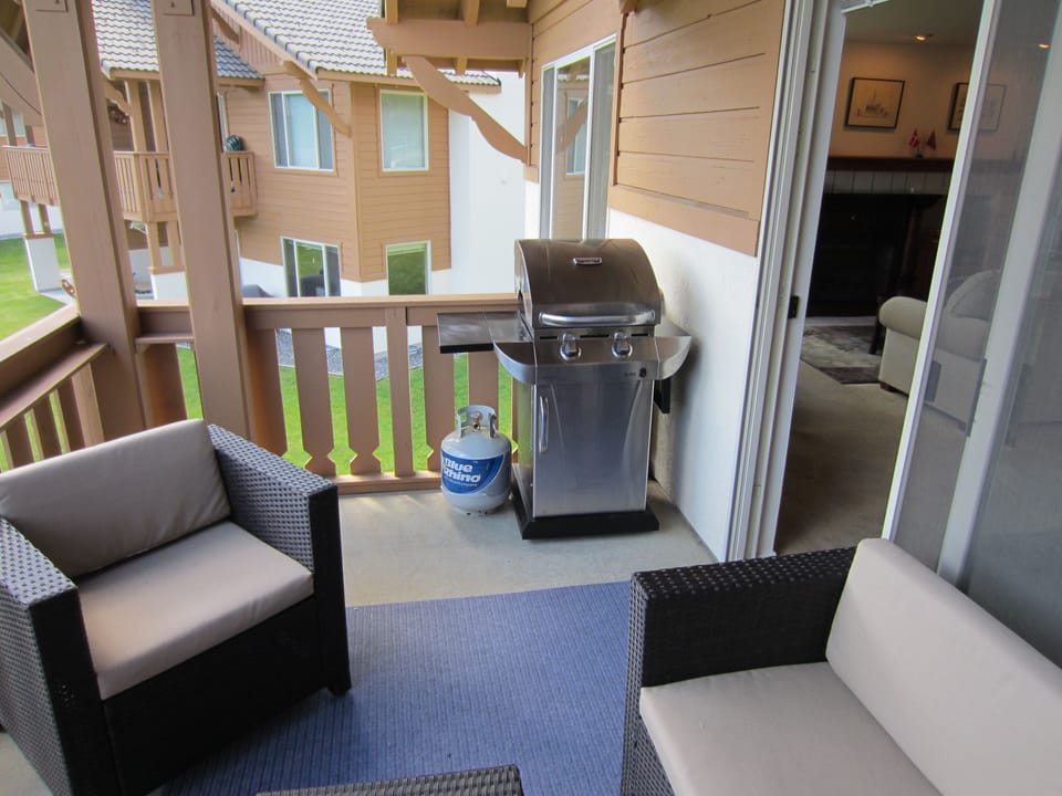 gas grill on the deck.