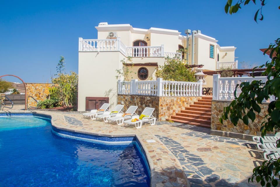Splash, relax, stairs for  rear entrance from large heated pool