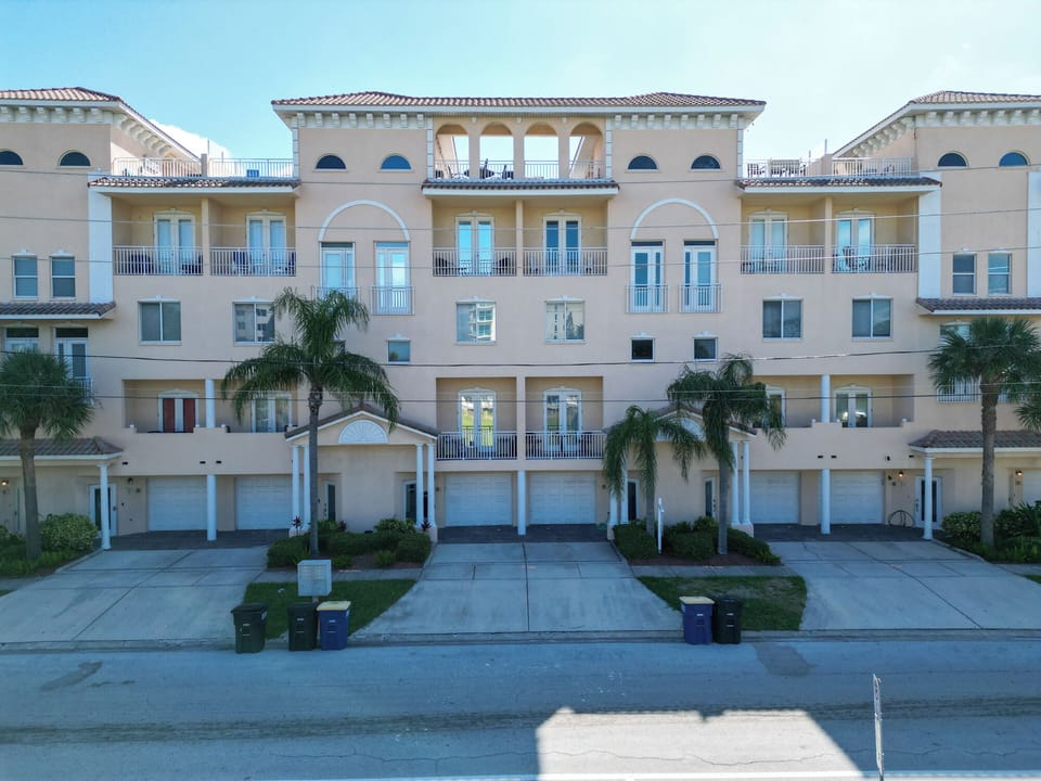 Townhouse is the middle unit with partially covered private rooftop terrace