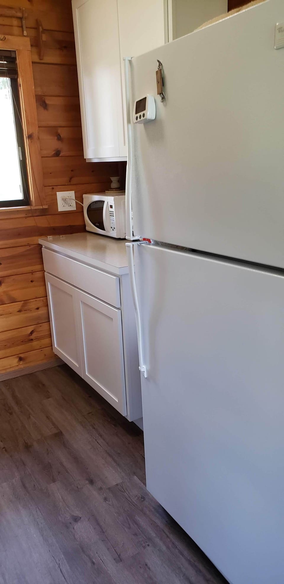 There is a coffee pot, toaster, micro wave oven,  large frig.