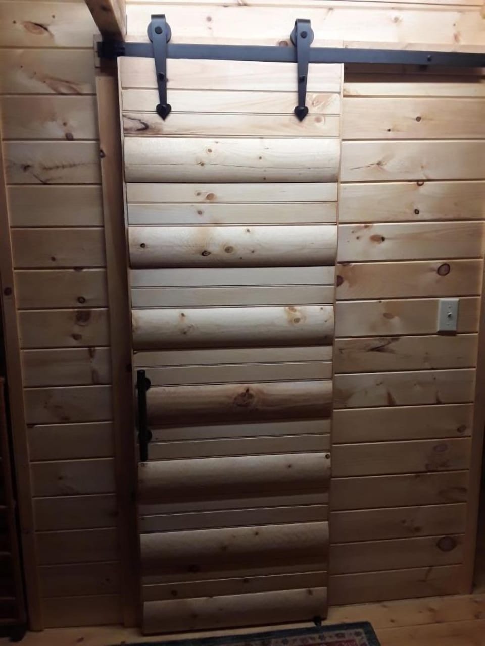 Door to half bath in loft area