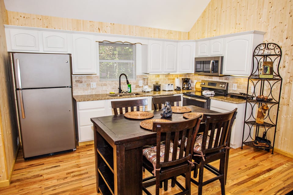 Dinning table sits 4, conveniently set by kitchen