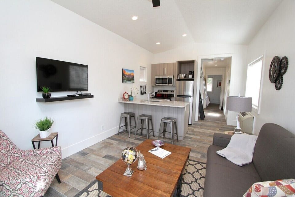 Your tiny home has everything you need including fast Wifi, flatscreen tv, king bed, loft area with twin beds and a fully stocked kitchen.
