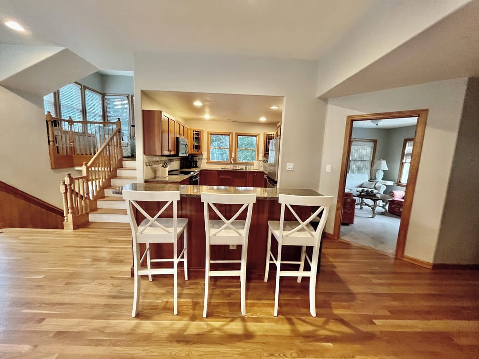 Top floor view of island, kitchen, "ships watch" (up), and "den" (to the right).