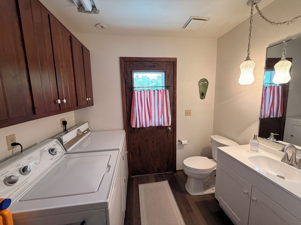 Half bath and laundry located on the first floor. 