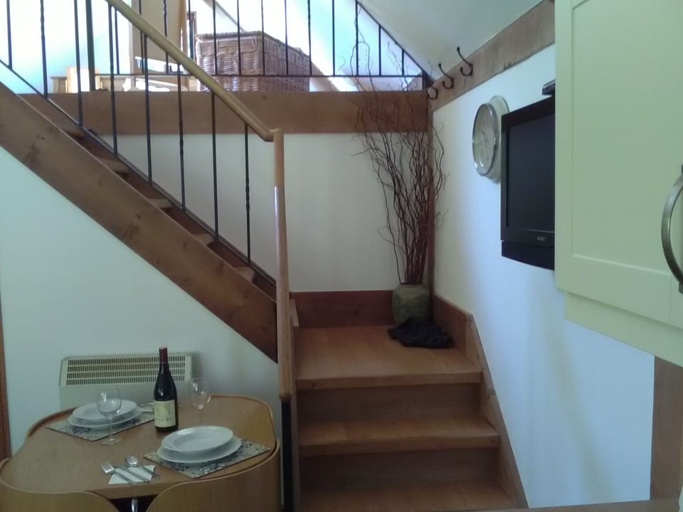 Stairs to large bedroom area