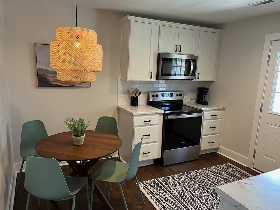 Kitchen with all the essentials, toaster, blender, coffee maker, and dishwasher.