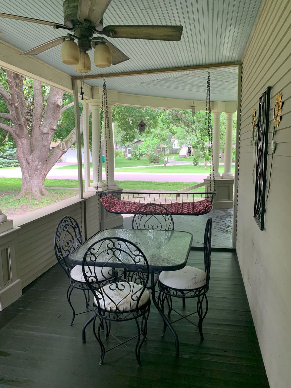 Side porch with table and swing