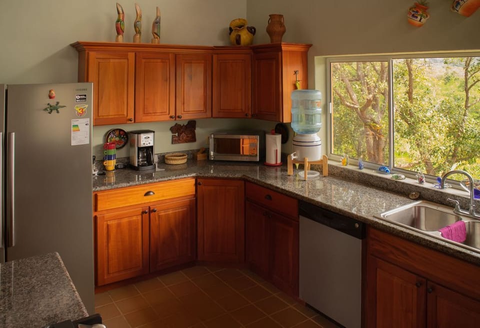 Large kitchen with granite counter tops and dishwasher