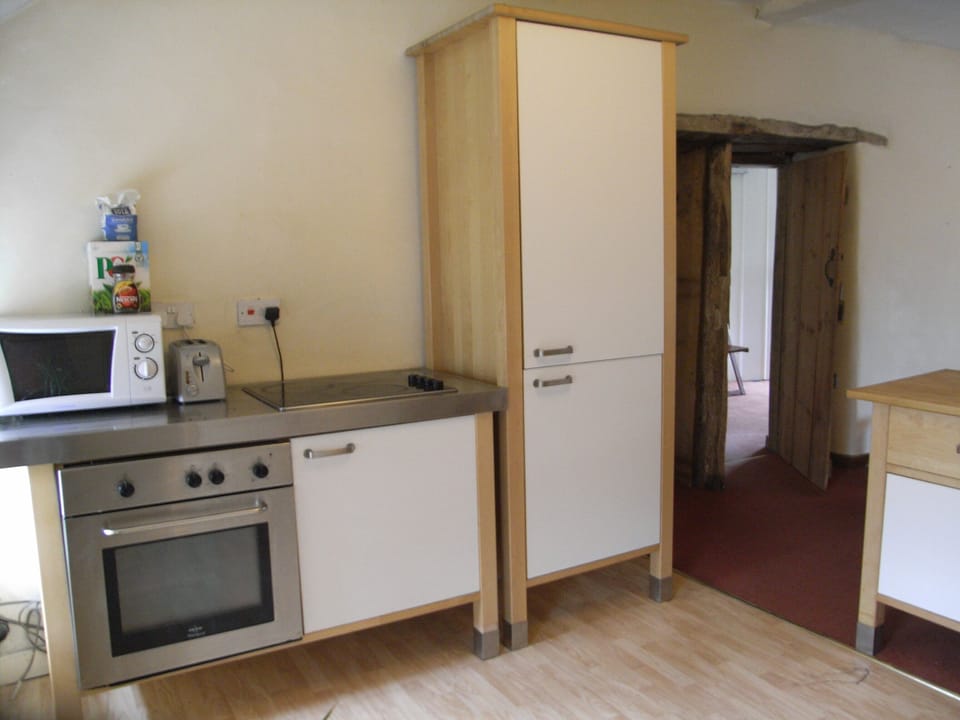 Fully equipped kitchen, with fridge freezer, oven and hob.