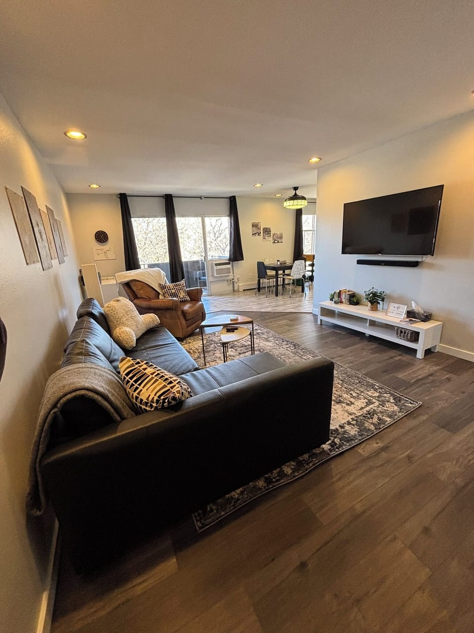 Living area from entry looking to balcony. Pull out sofa. Smart TV. Sound bar. 