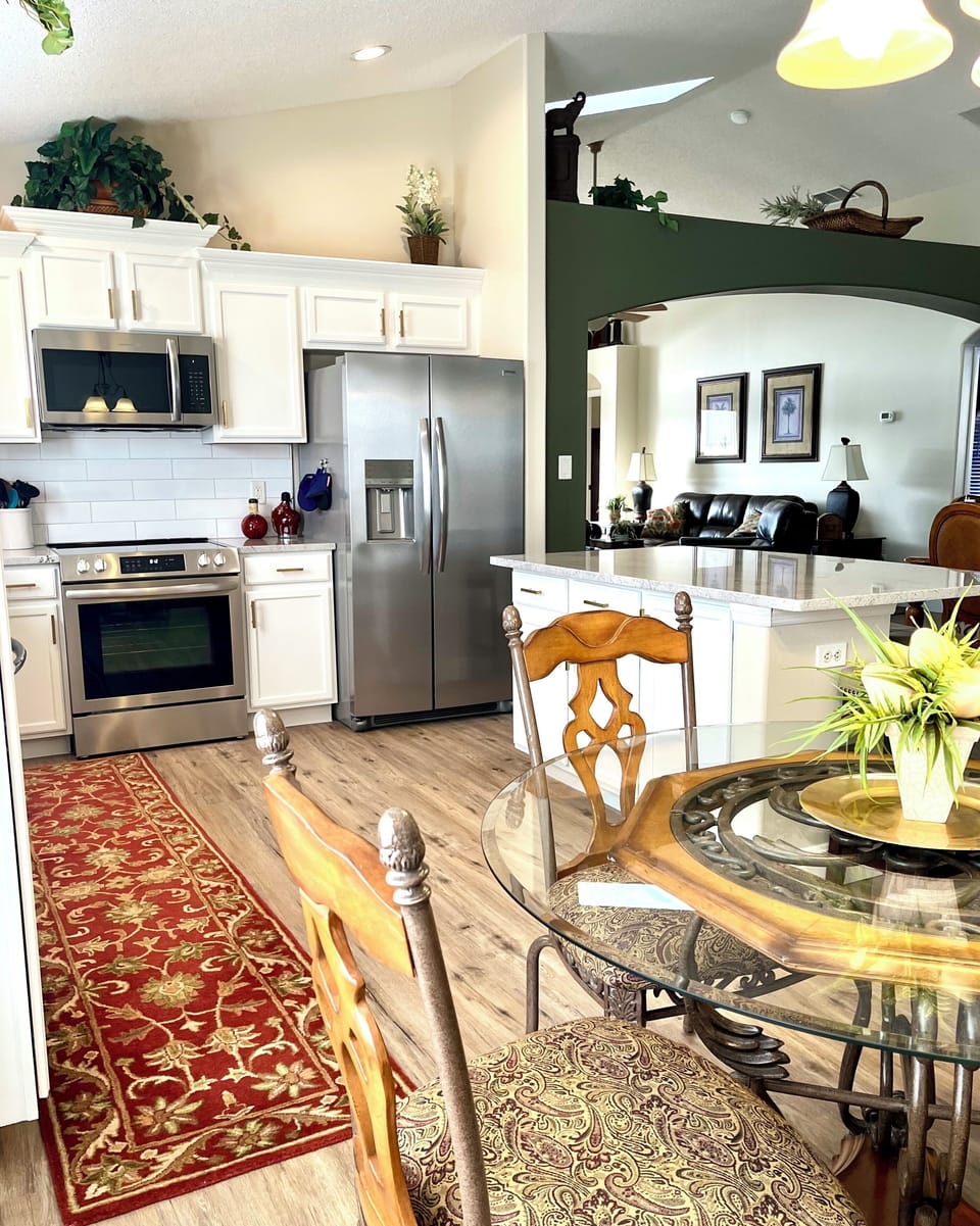 Well-appointed kitchen with large island and breakfast nook.