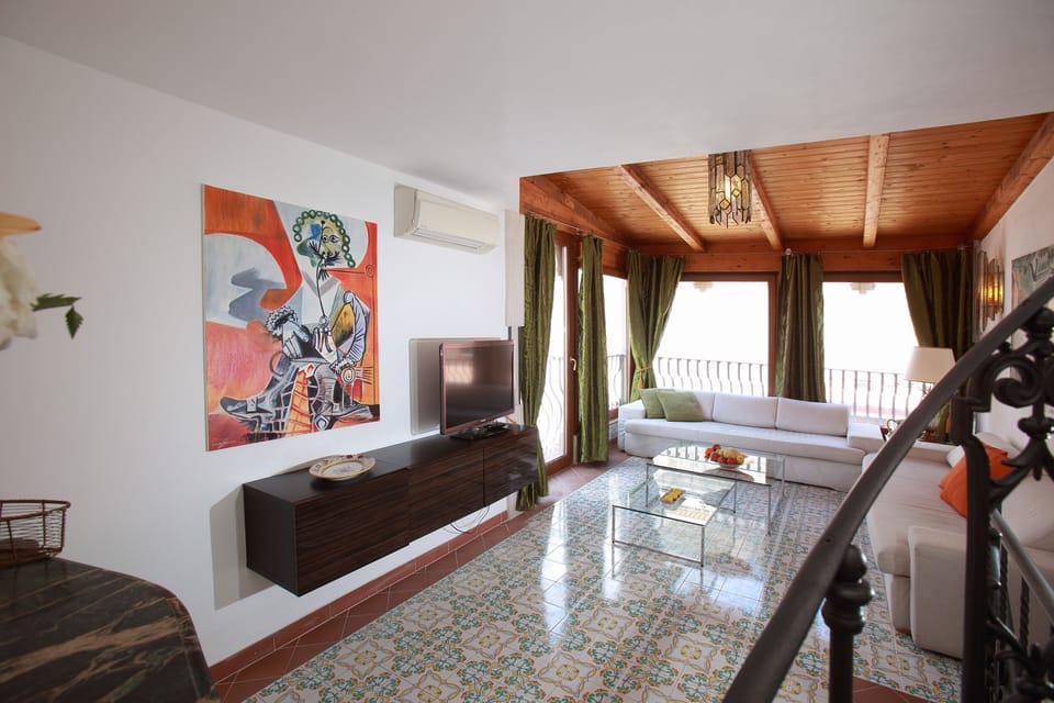 Living room with views on old town of Taormina and Mt Etna