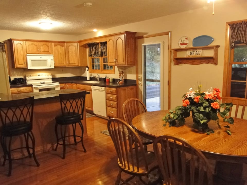 Kitchen with double oven and cookware. New Gas Grill right outside  the door.
