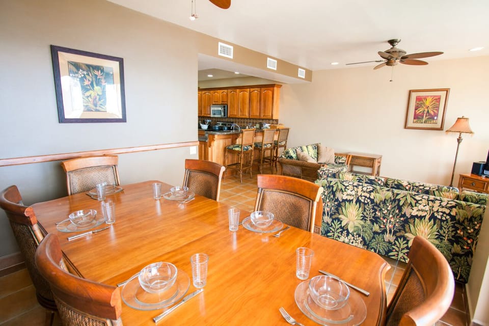 Dining for 8 with view of kitchen, living area and main patio