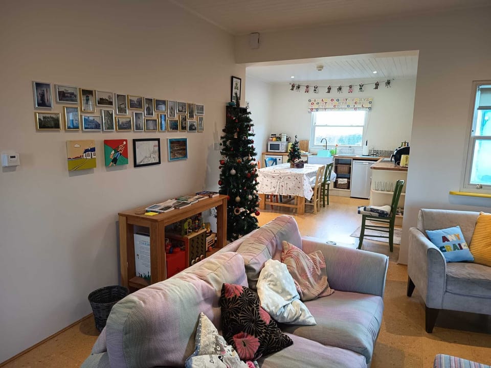 Comfy seating for six including a blue rocking chair : )