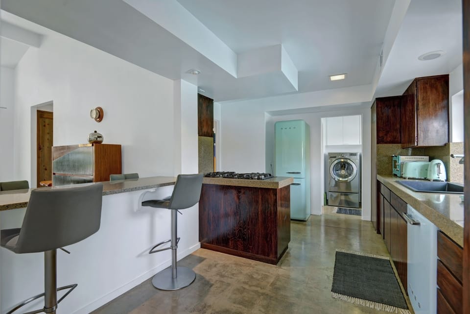 SMEG fridge and dishwasher keep the vibe going....