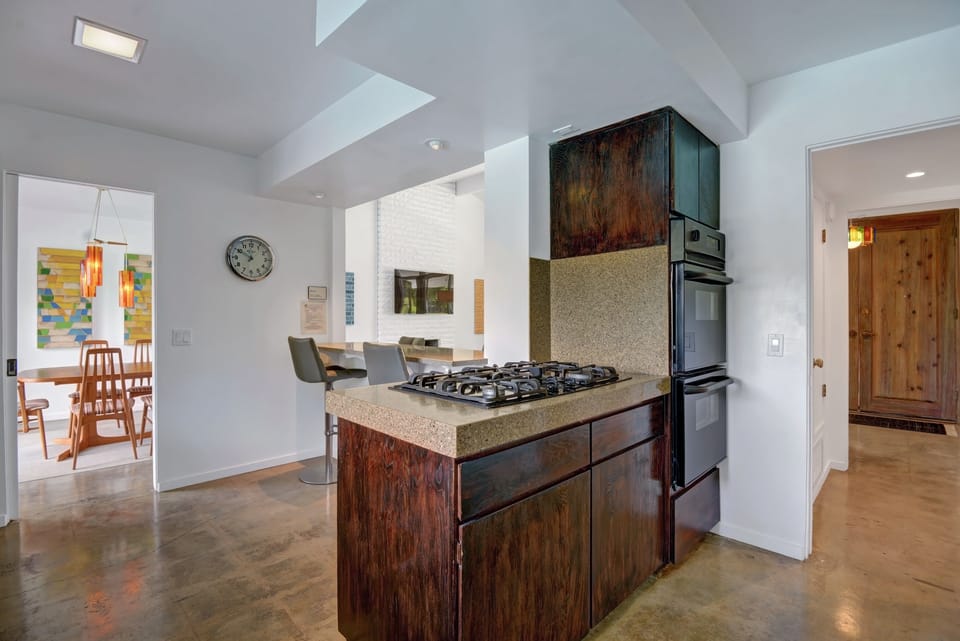 Gas stove island and ovens are newly installed.