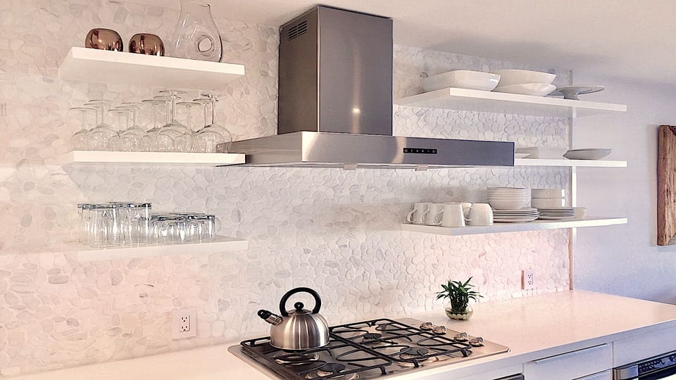 FREE-FLOWING, OPEN KITCHEN DESIGN, W/ WHITE PEBBLE BACKSPLASH