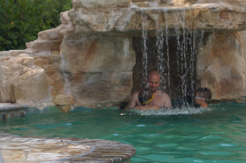 Enjoying the pool waterfall.