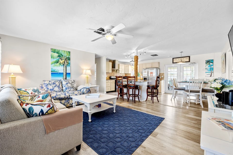 Open Concept Full View of Living room/Dining room and Kitchen/Bar area.