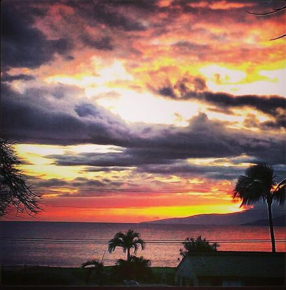 Sunset view from our lanai w/ the island of Lana'i and the West Maui mountains.