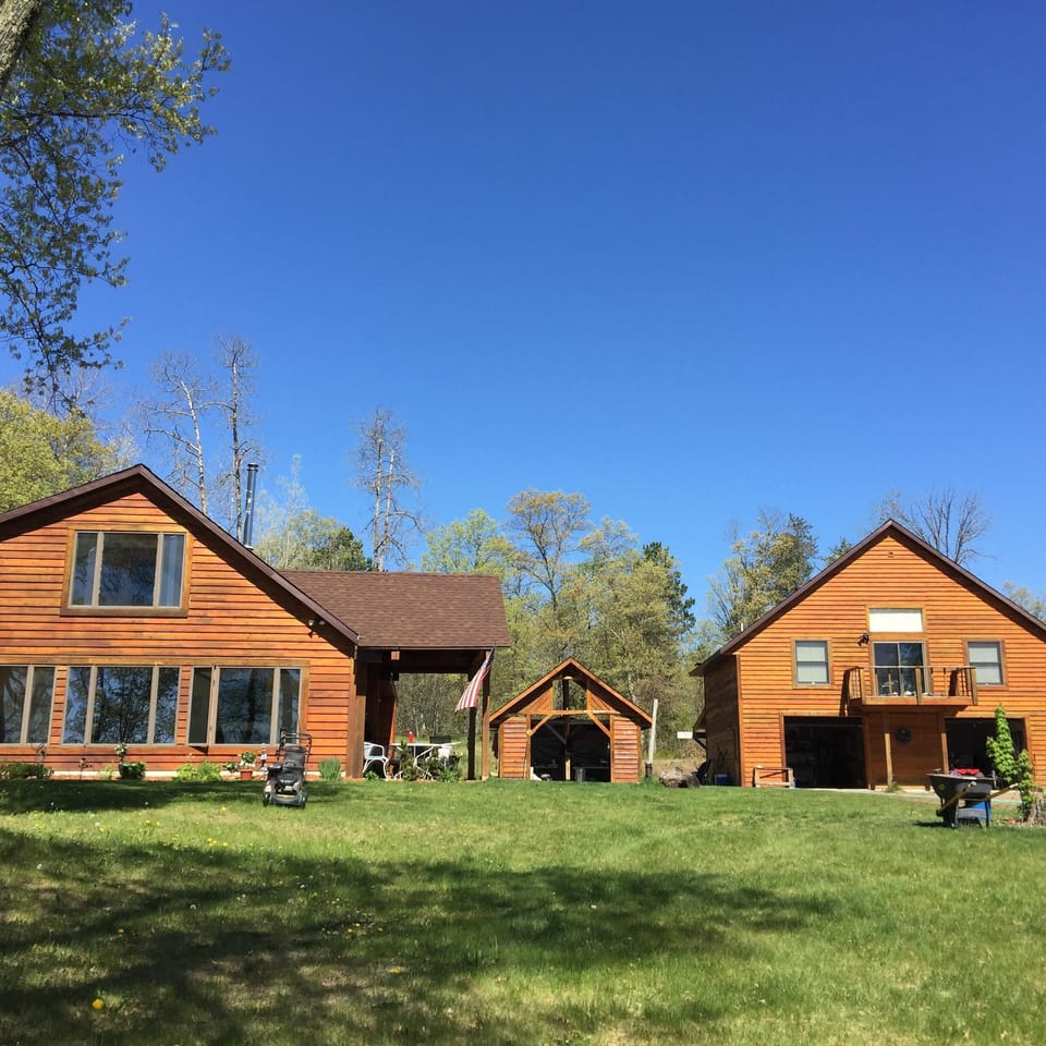 Cabin is on left. Guest house is on the 2nd story of the garage on the right.