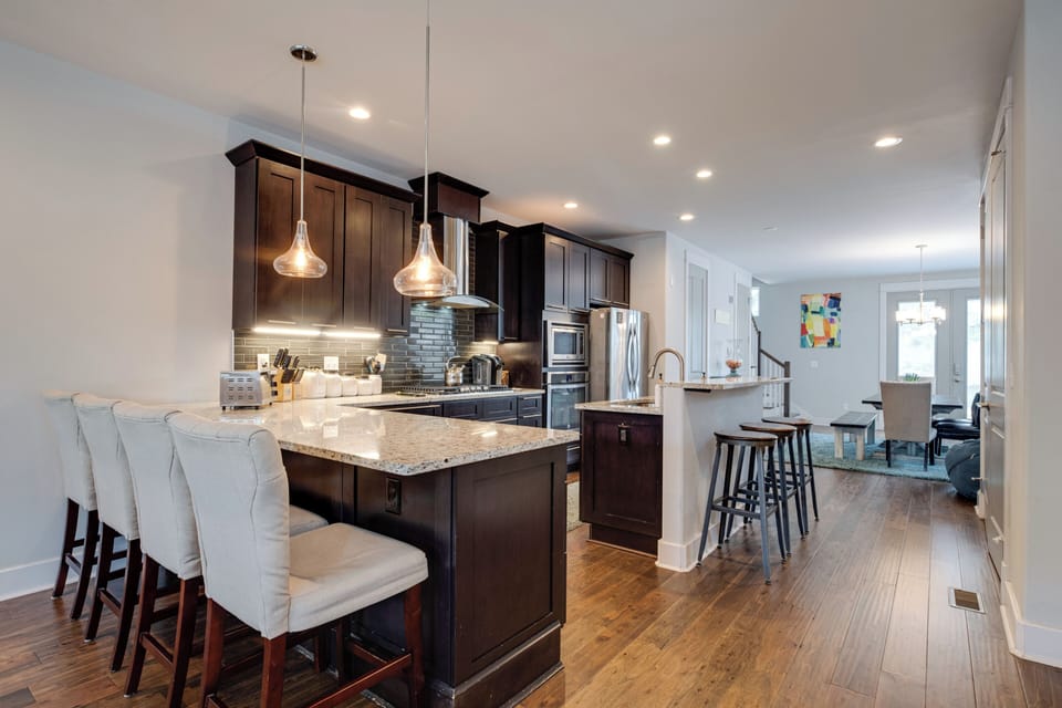 Fully Stocked Kitchen w/ Plenty of Bar Seating and Counter Seating