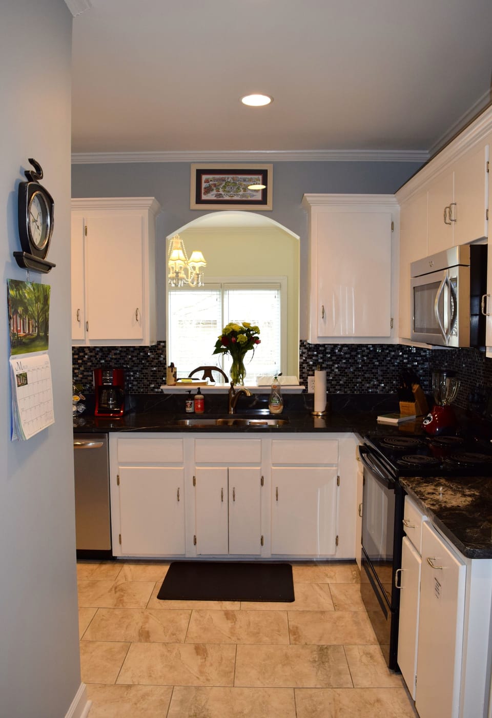 The fully-stocked kitchen provides utensils, dishes, and cleaning supplies.