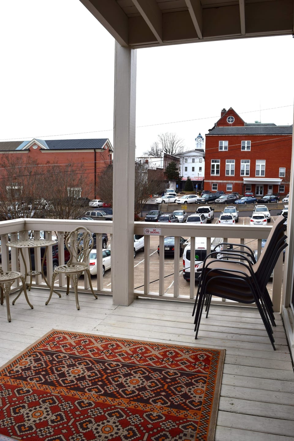 With a view of the Square, the downstairs balcony can seat up to 14 people.